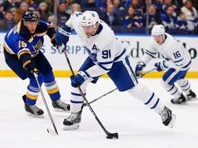 Maple Leafs forward John Tavares shoots the puck against Blues defenceman Jay Bouwmeester during NHL action at the Enterprise Center in St. Louis, on Feb. 19, 2019.