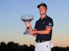 Kevin Na celebrates with the trophy after winning the Shriners Hospitals for Children Open on the second playoff hole during the final round at TPC Summerlin on Oct. 6, 2019 in Las Vegas, Nev. (Tom Pennington/Getty Images)