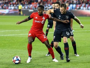 Richie Laryea left) of Toronto FC in action against D.C. United on Oct. 19. GETTY IMAGES