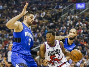 The Raptors' Kyle Lowry drives against the Orlando Magic's Nikola Vucevic on Monday Oct. 28, 2019 at Scotiabank Arena. (Ernest Doroszuk/Toronto Sun)