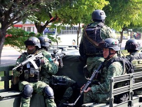 Members of a special unit of the Mexican Army conduct a patrol as part of an operation to increase security after cartel gunmen clashed with federal forces, resulting in the release of Ovidio Guzman from detention, the son of drug kingpin Joaquin “El Chapo” Guzman, in Culiacan, in Sinaloa state, Mexico, Oct. 19, 2019.