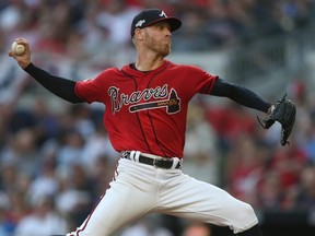 Braves starter Mike Foltynewicz pitches against the Cardinals in the seventh inning of Game 2 of the NLDS at SunTrust Park in Atlanta, on Friday, Oct. 4, 2019.