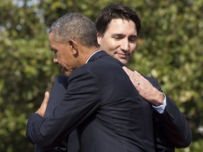 In this March 10, 2016, file photo, then-U.S. president Barack Obama hugs Prime Minister Justin Trudeau during an arrival ceremony on the South Lawn of the White House in Washington, D.C.