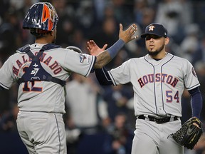 Houston Astros relief pitcher Roberto Osuna and catcher Martin Maldonado celebrate after defeating the New York Yankees at Yankee Stadium. (Brad Penner-USA TODAY Sports)