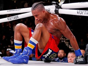 Patrick Day reacts after getting knocked down by Charles Conwell (not pictured) during a USBA Super-Welterweight fight at Wintrust Arena. ( Jon Durr-USA TODAY Sports)