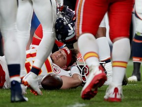 Chiefs quarterback Patrick Mahomes lays on the field after being injured against the Broncos on Thursday night in Denver. Mahomes will likely miss at least three weeks. (GETTY IMAGES)