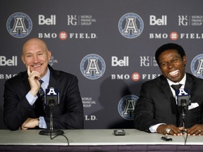 Argonauts president Bill Manning (left) and Mike (Pinball) Clemons share a laugh as Clemons is introduced as the CFL team’s general manager during a news conference on Tuesday at BMO Field. Manning knew changes were required in order for the Boatmen to turn the good ship around. (THE CANADIAN PRESS)