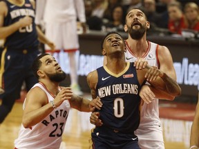 Pelicans’ Nickeil Alexander-Walker (middle) is sandwiched between Raptors’ Fred VanVleet (left) and Marc Gasol  during the second quarter at Scotiabank Arena Oct. 22, 2019. Jack Boland/Toronto Sun