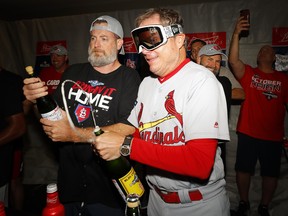 Manager Mike Shildt of the St. Louis Cardinals celebrates in the locker room after his team's 13-1 win over the Atlanta Braves in Game five of the National League Division Series at SunTrust Park on Oct. 9, 2019 in Atlanta. (GETTY IMAGES)