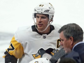 Penguins captain Sidney Crosby at his bench during a break in NHL action against the Jets in Winnipeg on Oct. 13, 2019.