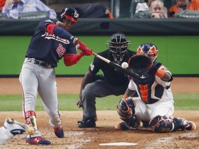 Juan Soto of the Washington Nationals hits a solo home run against the Houston Astros during the fourth inning in Game One of the 2019 World Series at Minute Maid Park in Houston on Oct. 22, 2019 (TIM WARNER/Getty Images)