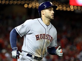 George Springer of the Houston Astros rounds the bases after his two-run home run against the Washington Nationals during the ninth inning in Game Five of the 2019 World Series at Nationals Park on Oct. 27, 2019 in Washington, D.C.