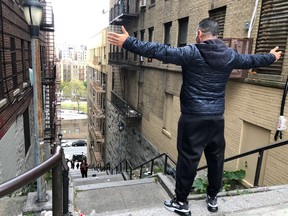 Patricio Osuna, a tourist from Tijuana, Mexico, poses atop the "Joker steps" in the Bronx borough of New York October 16, 2019. REUTERS/Isabella Jibilian