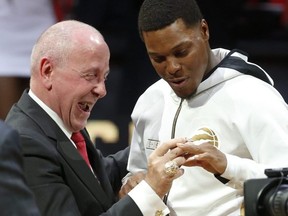 Toronto Raptors Kyle Lowry right) gets his ring from Larry Tannebaum  on Tuesday. JACK BOLAND/TORONTO SUN