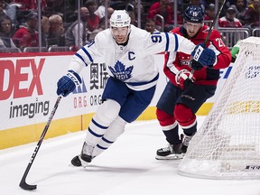 John Tavares of the Toronto Maple Leafs skates with the puck behind the net against the Washington Capitals at Capital One Arena on October 16, 2019 in Washington. (Scott Taetsch/Getty Images)
