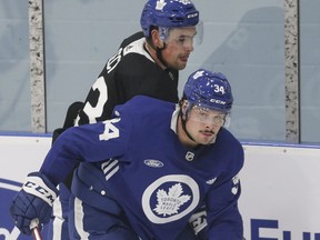 Leafs' Auston Matthews and Cody Ceci on the boards as the Toronto Maple Leafs held their last practice before tomorrow's season opener in Toronto on Tuesday October 1, 2019. Stan Behal/Toronto Sun/Postmedia Network