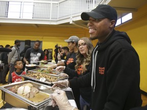 Toronto Raptors point guard Kyle Lowry is seen here serving up Thanksgiving dinner to 250 families in need at the John Innes Community Centre in 2019. His Lowry Love Foundation will provide meals to those in need again this weekend but Lowry and his family can't participate because of COVID travel restrictions.