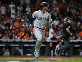 New York Yankees second baseman Gleyber Torres watches the ball leave the park for a solo home run against the Houston Astros in the sixth inning of Game 1 of the ALCS on Saturday night at Minute Maid Park. (Troy Taormina/USA TODAY Sports)