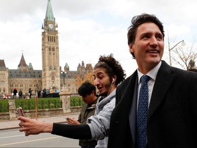 Prime Minister Justin Trudeau walks before speaking to reporters   on Oct. 23, 2019 --the first since Monday's election