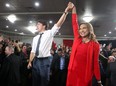 Liberal Leader Justin Trudeau in seen on stage with Nirmala Naidoo, Liberal candidate for Calgary Skyview, during a rally held late Saturday evening at the Magnolia Banquet Hall during the last days of the federal election campaign.