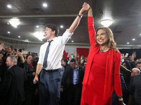 Liberal Leader Justin Trudeau in seen on stage with Nirmala Naidoo, Liberal candidate for Calgary Skyview, during a rally held late Saturday evening at the Magnolia Banquet Hall during the last days of the federal election campaign.