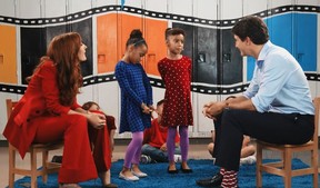 Justin Trudeau, right, answers questions from two girls and Jessi Cruickshank (Facebook)