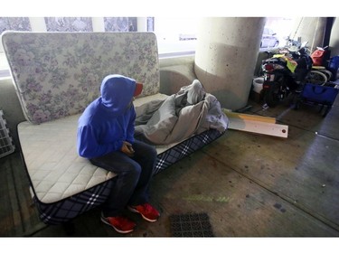 Neil dismantles his makeshift home after he was served with an eviction notice on Lower Simcoe Street in Toronto on Friday, October 4, 2019. Veronica Henri/Toronto Sun/Postmedia Network