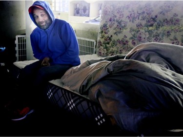 Neil dismantles his makeshift home after he was served with an eviction notice on Lower Simcoe Street in Toronto on Friday, October 4, 2019. Veronica Henri/Toronto Sun/Postmedia Network