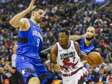 Toronto Raptors Kyle Lowry during first half action against Orlando Magic Nikola Vucevic at the Scotiabank Arena in Toronto, Ont. on Monday October 28, 2019. Ernest Doroszuk/Toronto Sun/Postmedia