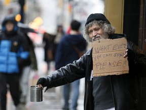 Peter Anthony experiences what it is like to be a panhandler on Yonge St., in Toronto on Wednesday October 30, 2019. Veronica Henri/Toronto Sun/Postmedia Network