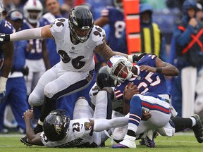 LeSean McCoy of the Buffalo Bills is tackled by Tony Jefferson, Brent Urban (96) and Michael Pierce of the Baltimore Ravens at M&T Bank Stadium on September 9, 2018 in Baltimore. (Patrick Smith/Getty Images)