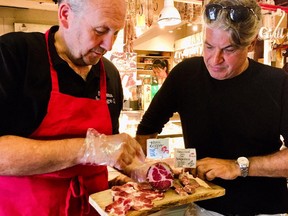 Renowned chef Kim Canteenwalla, right, visiting Jerome Dudicourt at Oayama Sausage in Granville Island Public Market. (Kevin Hann)