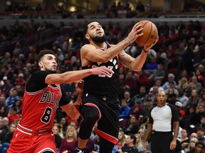 The Raptors' Fred VanVleet drives against Zach LaVine of the Chicago Bulls on Saturday night at the United Center.  (Stacy Revere/Getty Images)