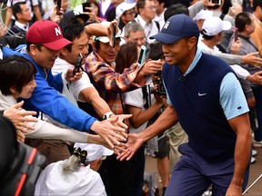 Tiger Woods of the United States interacts  with fans during The Challenge: Japan Skins at Accordia Golf Narashino Country Club on Oct. 21, 2019 in Inzai, Chiba, Japan. (Atsushi Tomura/Getty Images)