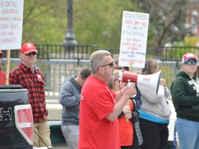 Elementary Teachers Federation of Ontario President Sam Hammond addresses a crowd at a rally outside the constituency office of Bruce-Grey-Owen Sound MPP and Minister of Government and Community Services Bill Walker on Friday in Owen Sound.
