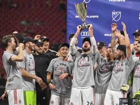 Toronto FC celebrates with the trophy after beating Atlanta United at Mercedes-Benz Stadium last week. (USA TODAY SPORTS)