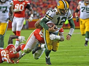Quarterback Aaron Rodgers of the Green Bay Packers gets tackled short of the goal line against the Kansas City Chiefs during the second half at Arrowhead Stadium on October 27, 2019 in Kansas City, Missouri.