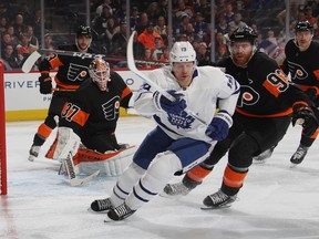 Brian Elliott #37 of the Philadelphia Flyers brushes aside a first period attempt by Jason Spezza of the Toronto Maple Leafs on Saturday. (Photo by Bruce Bennett/Getty Images)