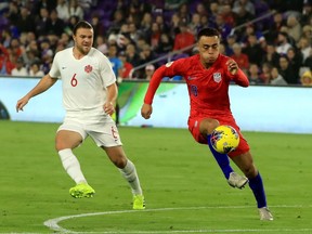 Sergino Destl right, of the United States controls the ball  during the CONCACAF Nations League match against Canada at Exploria Stadium on November 15, 2019 in Orlando, Florida.