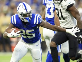 Marlon Mack of the Indianapolis Colts runs for a touchdown during the game against the Jacksonville Jaguars at Lucas Oil Stadium on Nov. 17, 2019 in Indianapolis, Ind. (Andy Lyons/Getty Images)