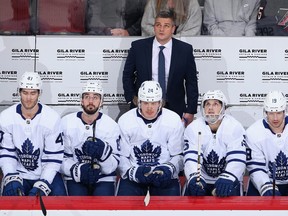 Head coach Sheldon Keefe of the Toronto Maple Leafs looks up from the bench during the first period of the NHL game against the Arizona Coyotes at Gila River Arena on November 21, 2019 in Glendale, Arizona. (Photo by Christian Petersen/Getty Images)