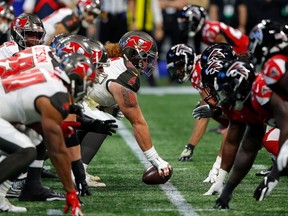 The Tampa Bay Buccaneers offense faces off against the Atlanta Falcons in the first half at Mercedes-Benz Stadium on November 24, 2019 in Atlanta, Georgia.