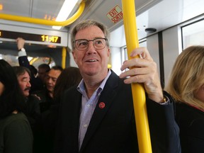 Mayor Jim Watson on the LRT on opening day Sept. 14.
