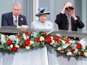 Britain's Queen Elizabeth watches the Epsom Derby with Prince Andrew (L) and Prince Philip, the Duke of Edinburgh, in Epsom, south of London on June 1, 2013. (Reuters)