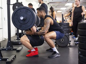 Sathish Muneeswaran, of Fit Squad, works with a client. (Toronto Sun photo)