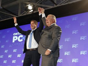 Federal Conservative Leader Andrew Scheer is congratulated by Ontario Premier Doug Ford at the Ontario PC Convention held at the Toronto Congress Centre on Nov. 17, 2018. (Jack Boland, Toronto Sun)