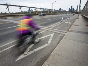 A cyclist on the bike lane along the Bloor Viaduct in Toronto on  May 9, 2019. (Ernest Doroszuk,Toronto Sun)