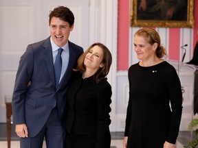 Chrystia Freeland poses with Prime Minister Justin Trudeau and Gov.-Gen. Julie Payette after being sworn-in as deputy prime minister in Ottawa on Nov. 20, 2019. (Reuters)