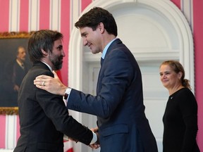 Canadian Prime Minister Justin Trudeau congratulates Steven Guilbeault after he was sworn-in as heritage minister during a ceremony at Rideau Hall on Nov. 20, 2019. (AFP via Getty Images)