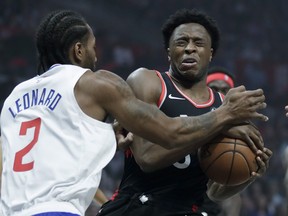 Toronto Raptors forward OG Anunoby reacts after getting hit in the eye by Los Angeles Clippers forward Kawhi Leonard during Monday's game. (AP PHOTO)